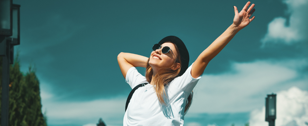 A Woman Throwing Her Hands Up Celebrating A Healthy Nervous System
