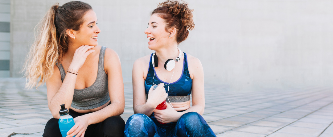 Two Sporty Women Discussing How To Replenish Electrolytes
