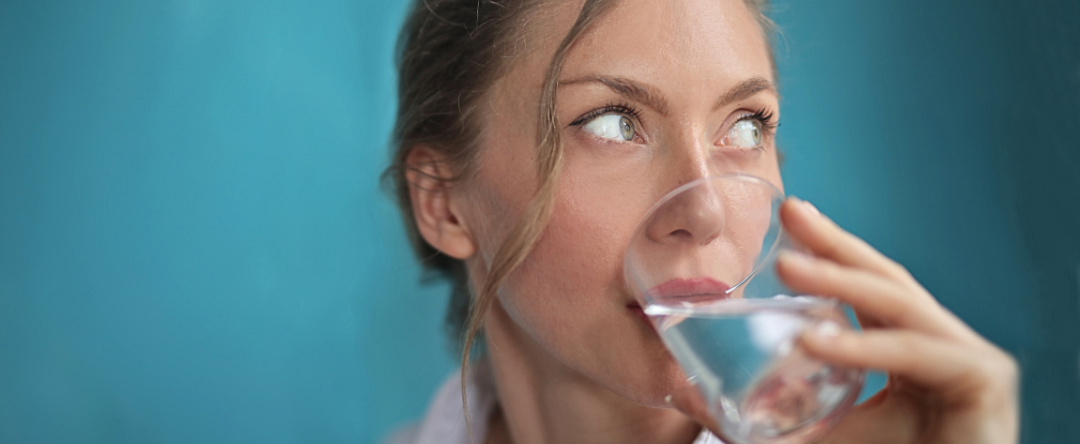 ​​​​A Person Drinking Water And Experiencing The Benefits Of Sodium