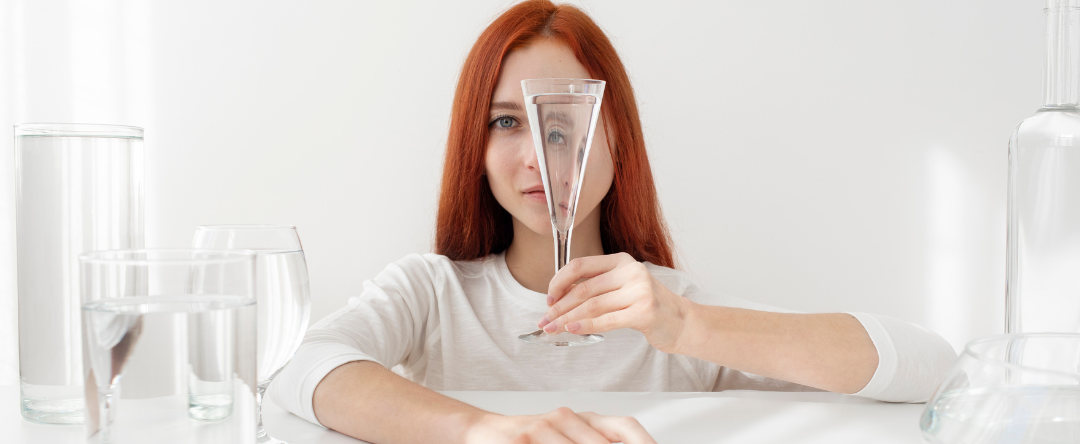 A Person Looking Through A Glass Of Water And Wondering, “Does Water Have Minerals?”
